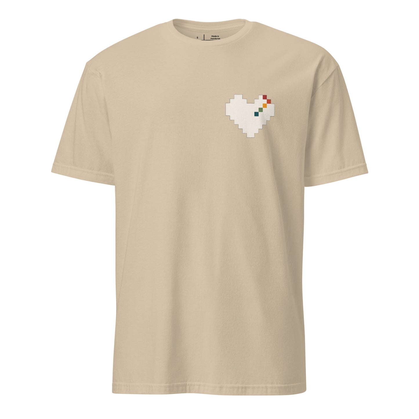 Pixel Heart Pride unisex tee in sand with a small pixel-art rainbow heart on the chest