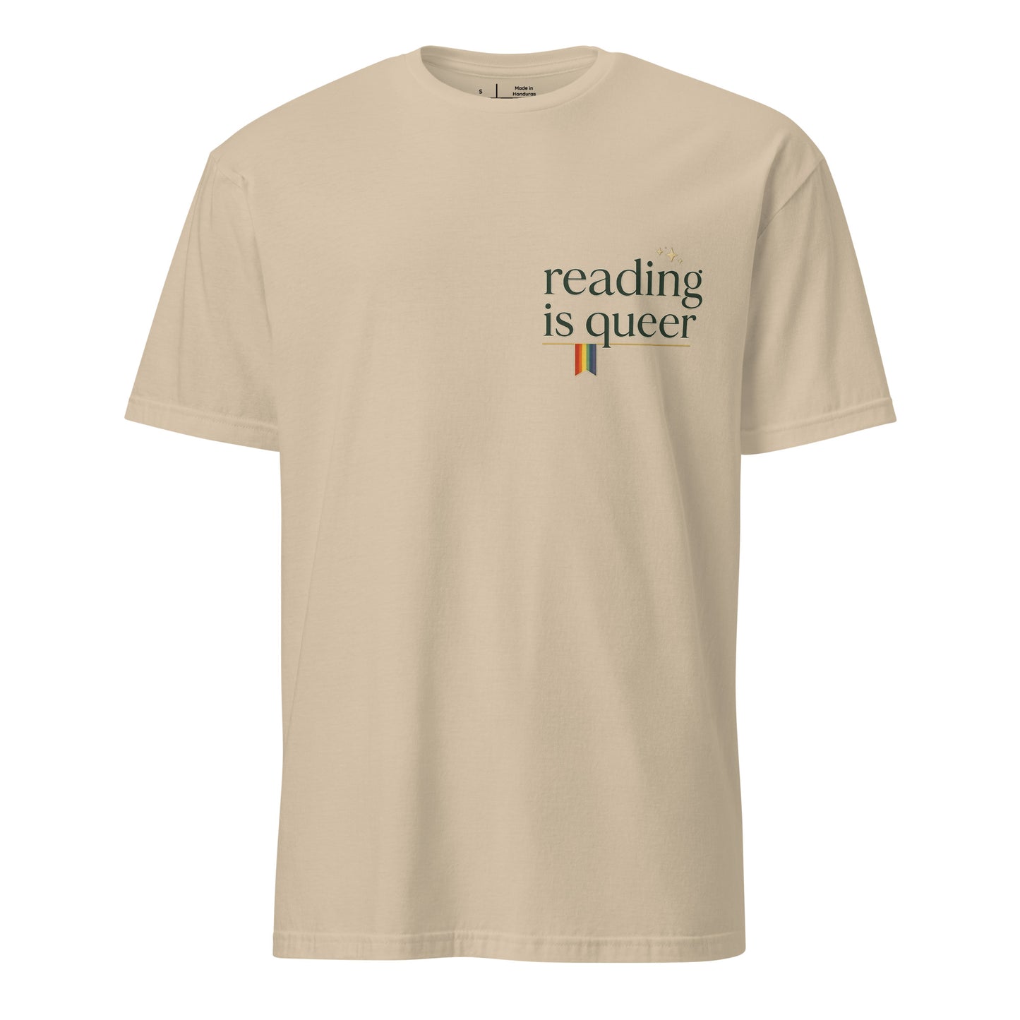 Reading is Queer unisex pride tee in sand with retro 'reading is queer' lettering and rainbow accent